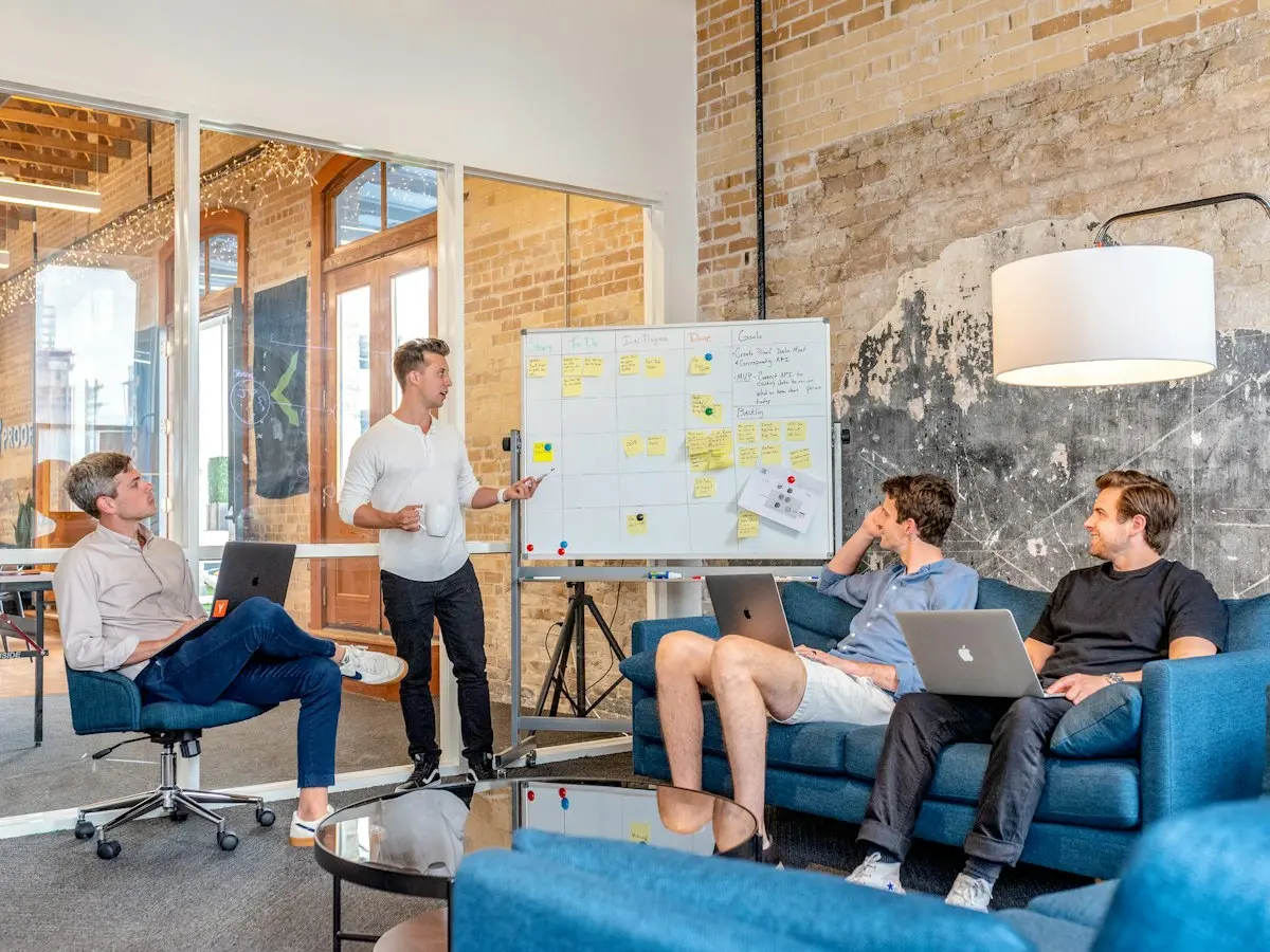 Agency team planning around a whiteboard